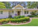 Inviting front porch with stylish columns and well-maintained landscaping at 305 Montevallo Dr, Atlanta, GA 30342