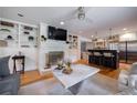Open-concept living room and kitchen area with hardwood floors and modern finishes at 305 Montevallo Dr, Atlanta, GA 30342