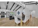 Bright dining area with modern lighting and an open layout to kitchen at 3165 Brookview Dr, Marietta, GA 30068