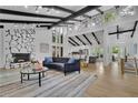 Spacious living room featuring a stone fireplace, vaulted ceilings, and large windows at 3165 Brookview Dr, Marietta, GA 30068