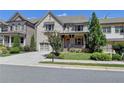 Charming two-story home with stone accents, covered porch, and well-manicured landscaping at 12095 Cameron Dr, Duluth, GA 30097