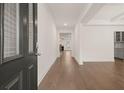 Inviting home foyer with hardwood floors and a view through to the living room at 1841 Lacebark Elm Way, Lawrenceville, GA 30045