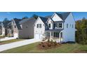 Attractive homes with well-maintained lawns and cozy front porches at 1871 Lacebark Elm Way Way, Lawrenceville, GA 30045