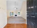 Spacious living room with fireplace and access to the outdoor patio at 2700 White Blossom Ln, Suwanee, GA 30024