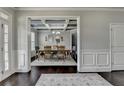 Elegant dining room with coffered ceiling and modern chandelier at 7575 Old Camp Lndg, Cumming, GA 30040