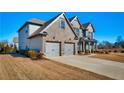 Well-maintained brick home with a spacious driveway and lush landscaping in a Gathering-friendly neighborhood at 7575 Old Camp Lndg, Cumming, GA 30040