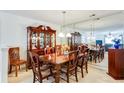 Elegant dining room with dark wood table, hutch and mirrored wall at 10202 Fairington Ridge Cir, Lithonia, GA 30038