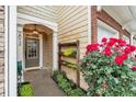 Inviting front entryway with plants, flowers, and well lit porch light at 2012 Ellison Nw Way # 15, Kennesaw, GA 30152