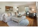 Bright living room featuring neutral colors, hardwood floors, a comfortable sofa, and stylish decor at 1972 Wingate Rd, Chamblee, GA 30341