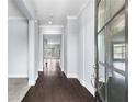 Inviting entryway featuring gleaming hardwood floors and stylish, neutral paint at 2222 Haventree Ct, Lawrenceville, GA 30043