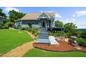Charming home with well-manicured lawn and landscaping, leading to a cozy and inviting entrance at 4940 Sunrise Ln, Cumming, GA 30041