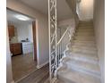 Inviting entryway with staircase and view of laundry room featuring white washer at 5685 Kingsport Dr, Sandy Springs, GA 30342