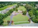 Sprawling estate with a long driveway, lush landscaping, and mature trees at 3898 Bay Creek Rd, Loganville, GA 30052