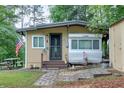 Charming home with a covered camper, an American flag and front yard at 5400 Kings Camp Rd Se #C1 Se Rd, Acworth, GA 30102