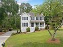Charming two-story home with a well-manicured lawn and inviting front porch at 1482 Pinebark Ct., Grayson, GA 30017