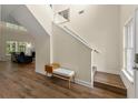 Bright foyer with hardwood floors, staircase, and views into the living area, creating a welcoming entrance at 3235 Avondale Pkwy, Powder Springs, GA 30127