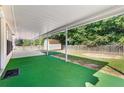 Spacious covered patio with a view of the backyard with a storage building at 2620 Matlin Way, Buford, GA 30519