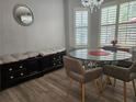 Cozy dining area with a round glass table, seating, and bright natural light at 5536 Strathmoor Manor Cir, Lithonia, GA 30058