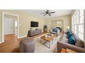 Cozy living room with hardwood floors, plush seating, and large windows at 2703 Flagstone Se Dr, Atlanta, GA 30316