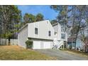 Charming two-story home featuring a well-manicured lawn, attached two-car garage and a mix of horizontal and vertical siding at 3813 Nowlin Nw Rd, Kennesaw, GA 30144
