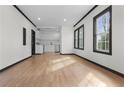 Spacious living room flows into kitchen with white cabinets and stainless appliances at 391 S Bend Se Ave, Atlanta, GA 30315