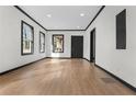 Bright living room with hardwood floors, fresh paint, and ample natural light at 391 S Bend Se Ave, Atlanta, GA 30315
