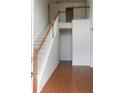 Bright foyer with hardwood floors and a staircase leading to the second level at 442 John Stewart Pl, Suwanee, GA 30024
