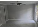 Living room featuring tile flooring, ceiling fan and natural light at 1947 Kensington High Sw St, Lilburn, GA 30047
