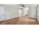 Spacious main bedroom with wood floors, ceiling fan, and en-suite bathroom at 3333 Devaughn Ne Dr, Marietta, GA 30066