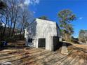 View of the garage, located on the side of this lovely home, with black framed glass doors at 3417 Hollow Tree Dr, Decatur, GA 30034