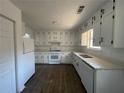 Well-lit kitchen with white cabinetry, new appliances, and sleek countertops at 3417 Hollow Tree Dr, Decatur, GA 30034