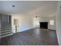 Open-concept living room featuring a decorative fireplace and light-filled windows at 3417 Hollow Tree Dr, Decatur, GA 30034