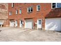 Rear of building with multiple garage doors and individual entrances at 322 Peters Sw St # 6, Atlanta, GA 30313