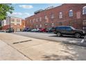 Rear of building with a parking lot featuring multiple parking spaces at 322 Peters Sw St # 6, Atlanta, GA 30313