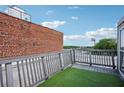 Cozy rooftop deck with artificial turf, views of cityscape, and privacy fencing at 322 Peters Sw St # 6, Atlanta, GA 30313
