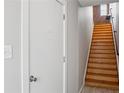 Interior wooden stairway with a white door at the bottom and window at top at 322 Peters Sw St # 6, Atlanta, GA 30313