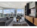 Open living room featuring floor-to-ceiling windows offering stunning views and modern decor throughout at 3325 Piedmont Ne Rd # 3005, Atlanta, GA 30305