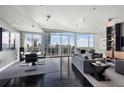 Spacious living area featuring hardwood floors, contemporary furnishings, and panoramic city views at 3325 Piedmont Ne Rd # 3005, Atlanta, GA 30305