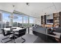 Sunlit living space featuring city views, modern chandelier, and neutral decor creating a serene atmosphere at 3325 Piedmont Ne Rd # 3005, Atlanta, GA 30305