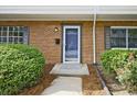 Close up of a front door, showcasing the brick exterior and well-manicured landscaping at 4701 Flat Shoals Rd # 35E, Union City, GA 30291