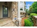 Inviting front entrance with stone accents, elegant door, and well-maintained landscaping create curb appeal at 1112 Cordia Nw Ave, Atlanta, GA 30318
