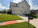 This home includes a two-car garage and a well-maintained lawn and driveway at 4316 Kershaw Dr, Snellville, GA 30039