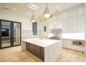 Bright kitchen with marble island, stainless appliances, and hardwood floors at 4550 Jolyn Pl, Sandy Springs, GA 30342