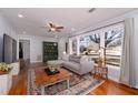 Cozy living room with hardwood floors, large windows, and comfortable sectional sofa at 2785 Toney Dr, Decatur, GA 30032