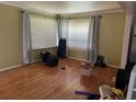 Sun-filled living room with hardwood floors and double windows at 2433 Tilson Rd, Decatur, GA 30032