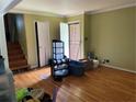 Entry way to living room with hardwood floors and open staircase at 2433 Tilson Rd, Decatur, GA 30032