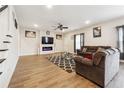 Inviting living room with wood floors, fireplace, and plush seating, perfect for entertaining at 2646 Neighborhood S Walk, Villa Rica, GA 30180