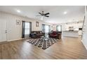 Spacious living room features wood floors and comfortable seating with an open concept floor plan at 2646 Neighborhood S Walk, Villa Rica, GA 30180