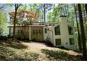 Exterior of a home featuring a deck, large windows, and beautiful landscaping at 3820 Fox Creek Ct, Marietta, GA 30062