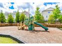 Community playground provides a fun and safe play area for children in a Gathering friendly neighborhood at 3313 Bartee Walk, Suwanee, GA 30024